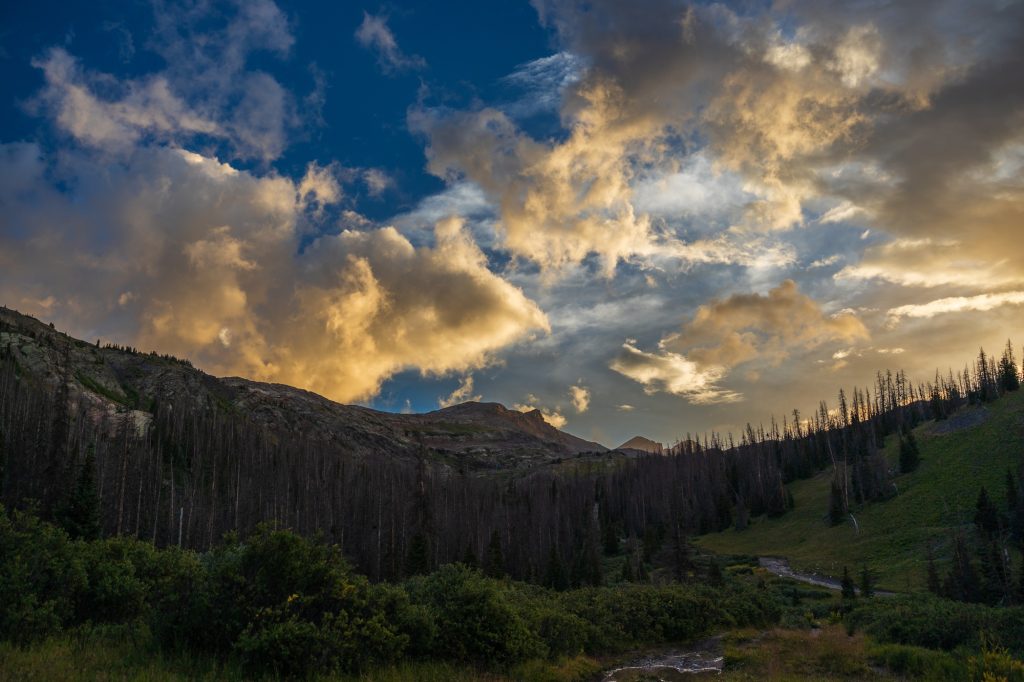 Sunset in the mountains with dramatic clouds